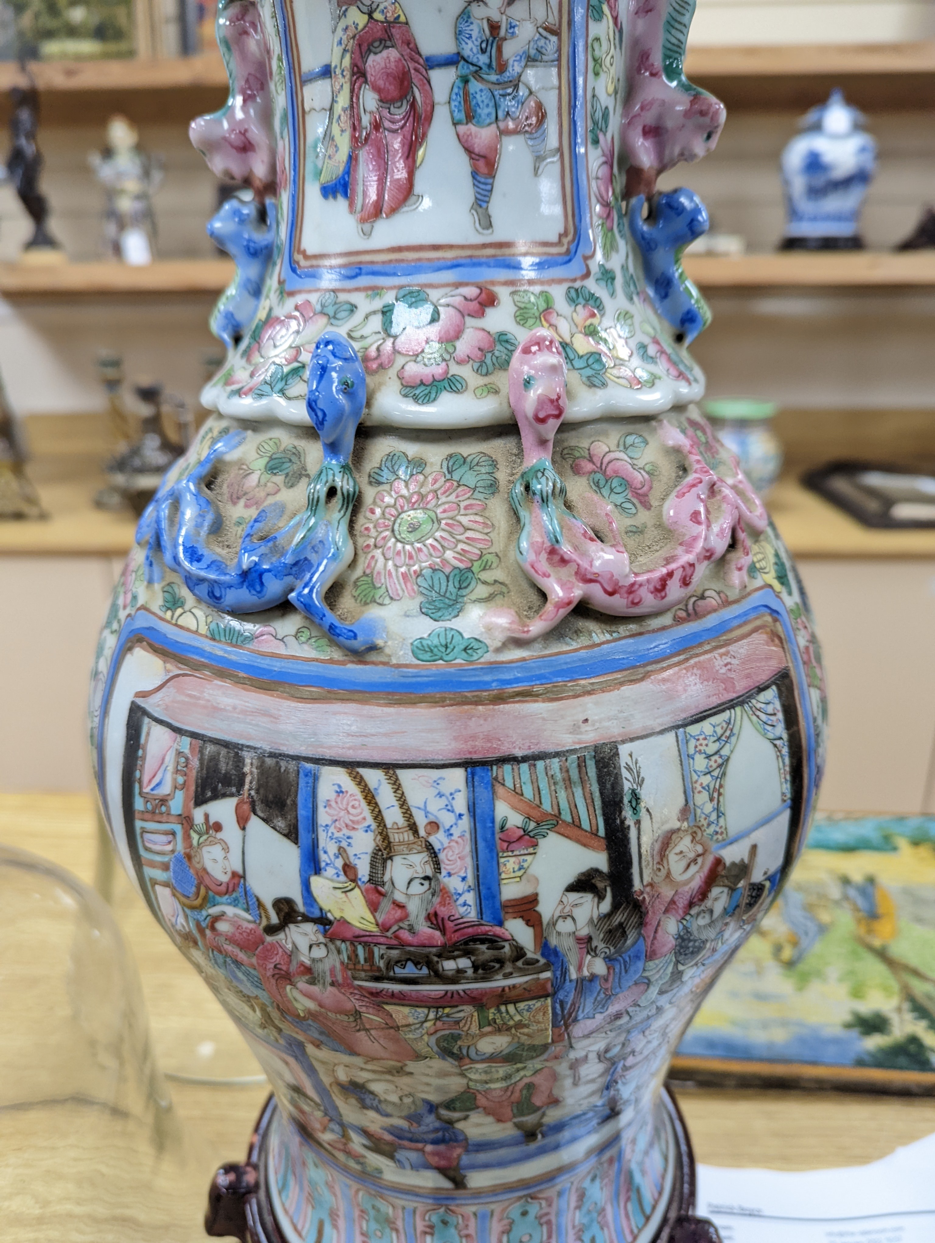 A large Chinese famille rose two handled vase, late 19th century, wood stand, restored 54cm incl stand
